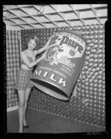 Model Stephany Hampson with display for Yenberg's All-Pure Evaporated Milk, Calif., circa 1950