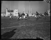 Football game between the Los Angeles Bulldogs and the Rochester Tigers at Gilmore Stadium, Los Angeles, November 14, 1937