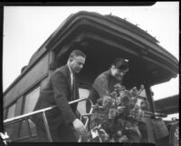 Eleanor Roosevelt receives welcome bouquet upon arrival at Central Station, Los Angeles, October 1, 1935