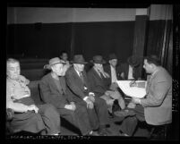 Aleon Bennett taking census at Midnight Mission in Los Angeles, Calif., 1950