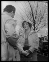 Frances Moran photographed while speaking to an unidentified man, Los Angeles, 1930s