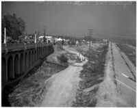 Spectators gather to view damage caused by the Elysian Park landslide, Los Angeles, November 1937