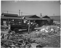 Members of the Unemployed Citizens' League of Santa Monica work together to load a pickup truck, Santa Monica, 1930s