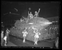 Pre-Christmas parade in downtown; features rocket ship float with Santa Claus in Los Angeles, 1940