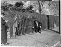 Police Captain Edward Ayres points at the site of an old volcano in Elysian Park, Los Angeles, November 1937