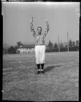 College football referee Bruce Kirkpatrick demonstrating hand signals, Los Angeles, circa 1935