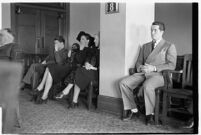 Private detective Pearl Antibus appears in court with her daughter Norma Thelan and son Robert Antibus during her trial against millionaire Thomas W. Warner, Sr, Los Angeles, 1938