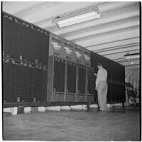 Horse racing scoreboard on Tony Cornero's newly refurbished gambling ship, the Bunker Hill or Lux, Los Angeles, 1946