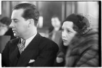 Actor Ben Lyon with his wife, actress Bebe Daniels, during a trial for Albert F. Holland, who wrote 150 love letters to Daniels, Los Angeles, 1933