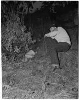 Harlan Bunker lays next to the body of his 11-year-old murdered daughter, Marilyn Bunker, Los Angeles, 1940