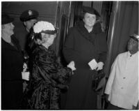 Antoinette Jones welcomes Secretary of Labor Frances Perkins upon her arrival by train, Los Angeles, 1940