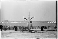 Crowd gathers to catch a glimpse of the airplane that set a world record, flying non-stop from Moscow to southern California. July 14, 1937