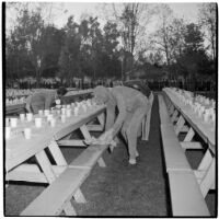 Costumed men setting up picnic tables for the post-war Labor Day celebration, Los Angeles, 1946