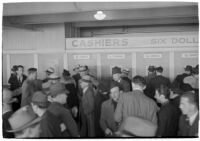 Spectators place their bets on opening day of Santa Anita's fourth horse racing season, Arcadia, December 25, 1937