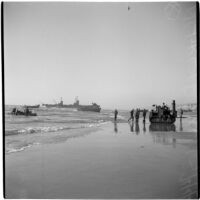 Military personnel on the beach during the Army-Navy maneuvers that took place off the coast of Southern California in late 1946