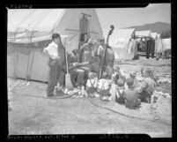 Musicians entertaining children at Farm Security Administration camp during cherry harvest, Beaumont, 1939