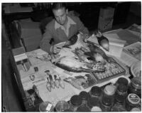 Ornithologist Granville P. Ashcraft with specimens collected by a team of U.S.C. scientists during their exploration of the Gulf of Lower California, Los Angeles, February 21, 1940