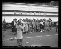 Susan B. Anthony Club members having picture taken in front of Freedom Train in Los Angeles, circa 1948