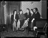 Members of the Young Communist League sitting together on a couch, Los Angeles
