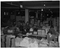 Employees at The May Co. prepare merchandise for downtown Dollar Day, Los Angeles, 1940