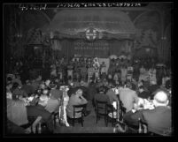 Audience watching Native American Indians on stage at event for Santa Fe Railroad 100 million miles of diesel travel, Los Angeles, Calif., circa 1948