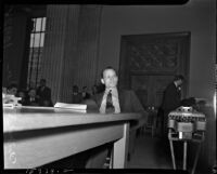 Grand jury member Clifford E. Clinton in the courtroom where he is charged with contempt, Los Angeles, 1937