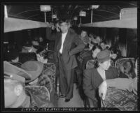 Japanese nationals on a bus during evacuation and relocation