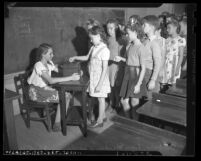 Class of school children donating money to Los Angeles War Chest, circa 1943