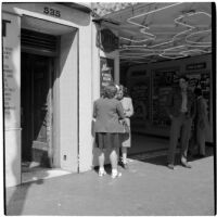 Woman talking to a truant girl in downtown Los Angeles, March 1946