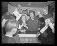 Actors Bud Abbott, Lou Costello and Lila Dean selling war bonds at Defense House in Los Angeles, Calif., circa 1942