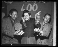 David Yee, Alan Young and Frank Tang joking around with firecrackers during Chinese New Year in Los Angeles, 1948