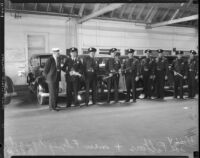 Detective Lieutenant Joe Filkas with members of a special squadron organized to combat criminals who attack women and children, Los Angeles, 1935