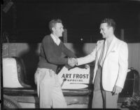 Race car drivers Rex Mays and Bob Swanson pose at the Legion Ascot speedway, Los Angeles, 1935