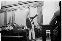 Public defender Ellery Cuff indicating a point on a map at his client Albert Dyer's murder trial, Los Angeles, 1937