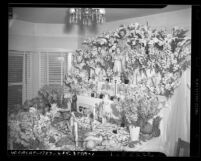 St. Joseph shrine laden with flowers, bread, pastries and fruit, circa 1946