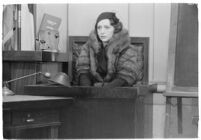 Actress Bebe Daniels on the witness stand during a trial for Albert F. Holland, who wrote 150 love letters to Daniels, Los Angeles, 1933