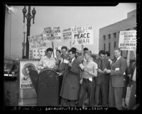 Men mailing their draft cards to the U.S. president during "conchie" demonstration outside Los Angeles Federal Building, 1947