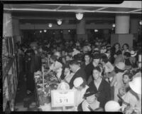 Crowd shops at May Company department store during Dollar Day sale, Los Angeles, 1935