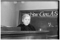 Private detective Pearl Antibus testifies against millionaire Thomas W. Warner, Sr by recalling the events and damages that occured during a raid of her home that was conducted at Warner's request, Los Angeles, 1938