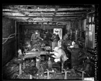 Police inspecting burned out interior of bar after explosion in Los Angeles, Calif., 1949