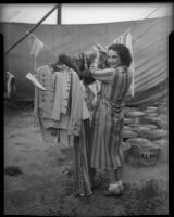 Aerialist Bertha Matlock poses by her circus outfits, Los Angeles, 1935