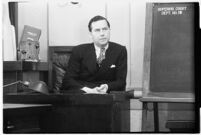 Actor Ben Lyon on the witness stand during a trial for Albert F. Holland, who wrote 150 love letters to Lyon's wife, actress Bebe Daniels, Los Angeles, 1933