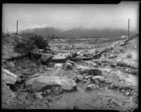 Flood waters in rocky channel, Los Angeles, 1934