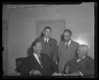 Pat Casey (left) and Herb Sorell (right) sit and talk during Hollywood labor dispute, 1944