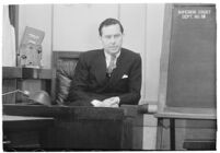 Actor Ben Lyon on the witness stand during a trial for Albert F. Holland, who wrote 150 love letters to Lyon's wife, actress Bebe Daniels, Los Angeles, 1933