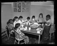 Children eating Thanksgiving dinner at Salvation Army Day Nursery School in Los Angeles, Calif., 1953