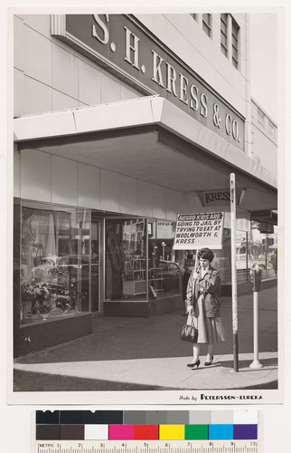 Woman picketing outside S.H. Kress & Co. store, Fairbanks, Alaska