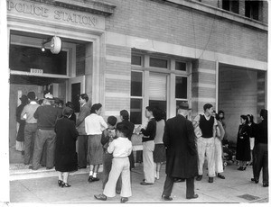 "View of Hollenbeck Police Station as Axis nationals, mostly Japanese, lined up yesterday to turn in cameras and radios under U.S. orders.--caption on photograph