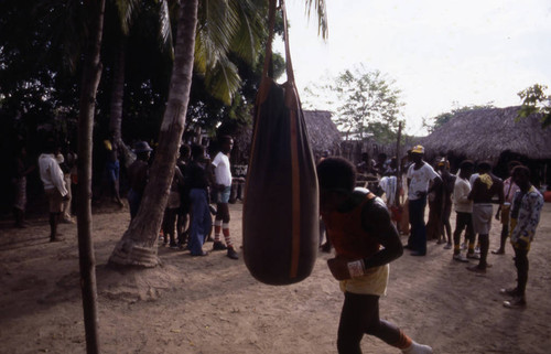 Boxer working out on punching bag, San Basilio de Palenque, 1976
