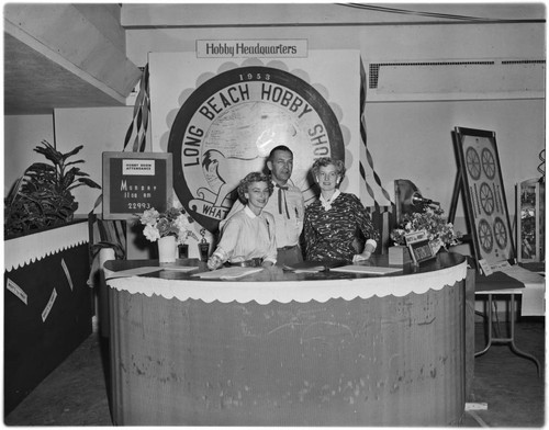 Hobby show officials at desk